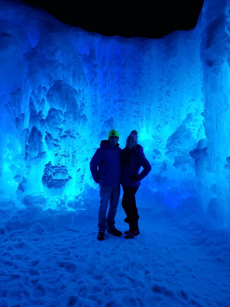 Ice Castles in Dillon, Colorado. Blue lights lighting up the ice. 